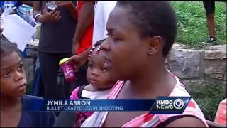 Vigil honors teen shot dead with baby in his arms