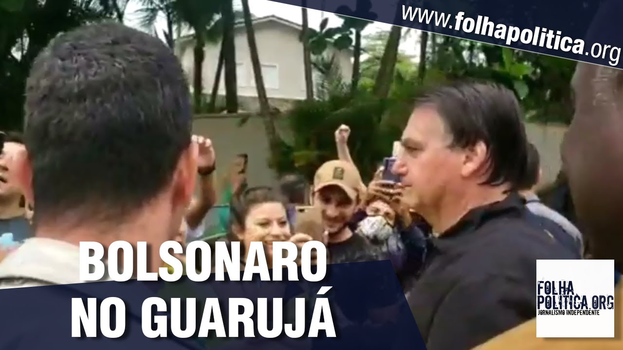 Mesmo com chuva, Bolsonaro é recepcionado e tira fotos com cidadãos em Guarujá - São Paulo