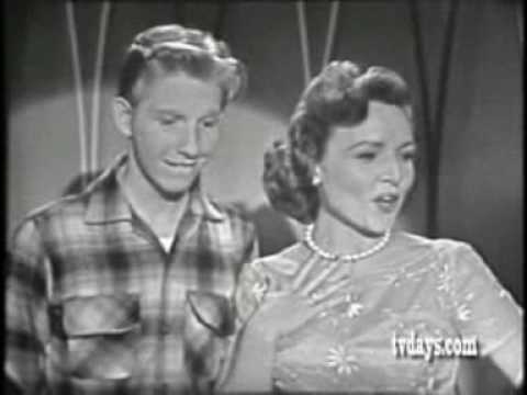 Betty White and Jimmy Boyd singing With A 'No' Tha...