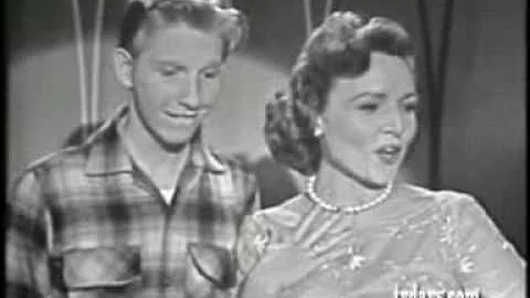 Betty White and Jimmy Boyd singing With A 'No' Tha...