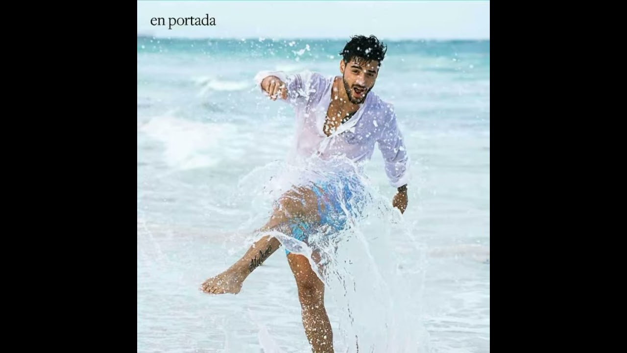 Portrait of handsome sunbathed fashion man model posing on summer beach  with white sand on blue sky and ocean background Stock Photo by ©alexhalay  171945420