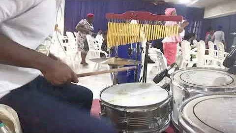Playing African beats in African praises.
