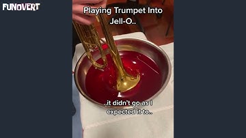 Playing trumpet into jello