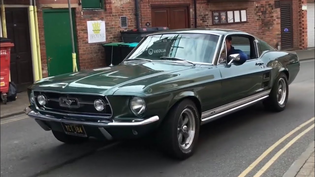Classic cars arriving at a car meet, Lincoln castle classic car show