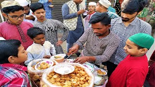 Young boys are waiting to eat hot spicy pani puri Tk 10 per plate