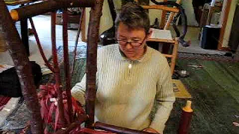 Cynthia Kingsbury weaving a seat on a new chair