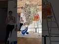 Creating a huge three-dimensional chandelier from hand-cut paper collage