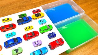 Various Diecast Model Cars Sliding Into The Green And Blue Water