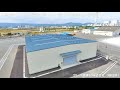 システム建築「相馬エネルギーパーク合同会社 木質ペレット等一時保管倉庫（1号埠頭）」空撮 - (株)横河システム建築