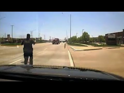 Officer Grabs Toddler from Side of Busy Road