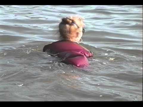 Lady in her work clothes swimming. (Candid)