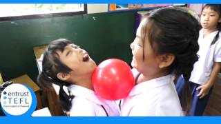 Playing a simple ball game in class with young students.