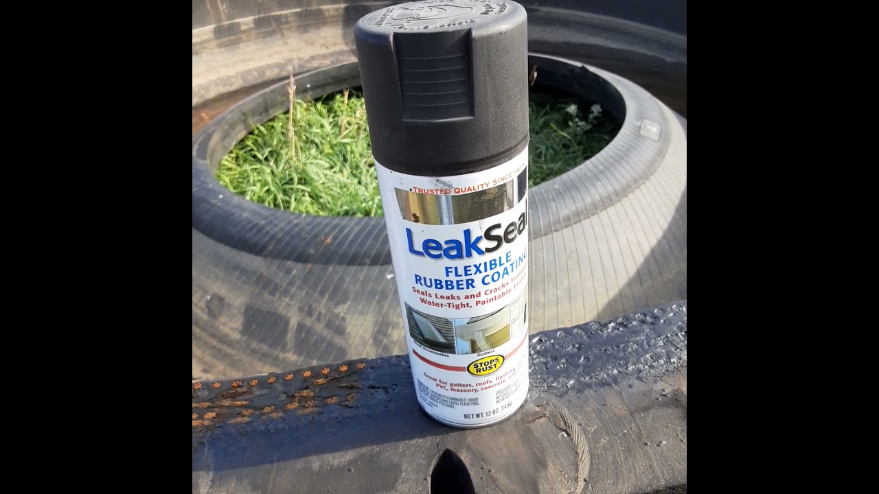 GRINDING WIRE OFF GIANT RUBBER TIRE WATER TANKS, BIG, LARGE, MINE TIRE PREPARATION FOR CATTLE USE