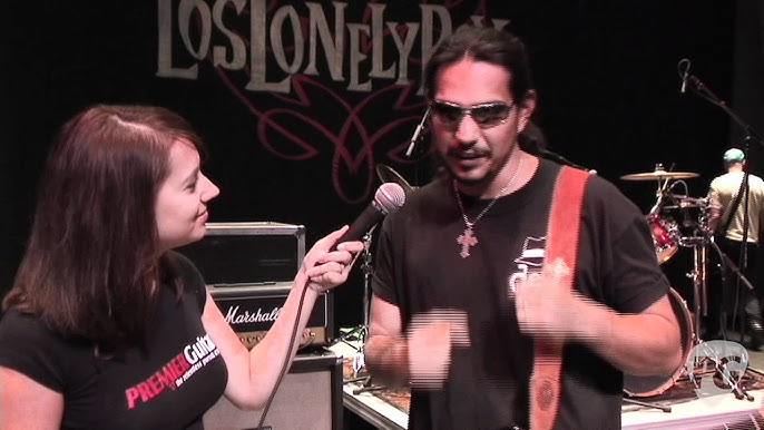 JoJo, bass guitar player for the Grammy Award winning Rock-N-Roll trio Los  Lonely Boys, grimaces as he plays during a music concert featuring the  Texas based band, at Contingency Operating Base Speicher