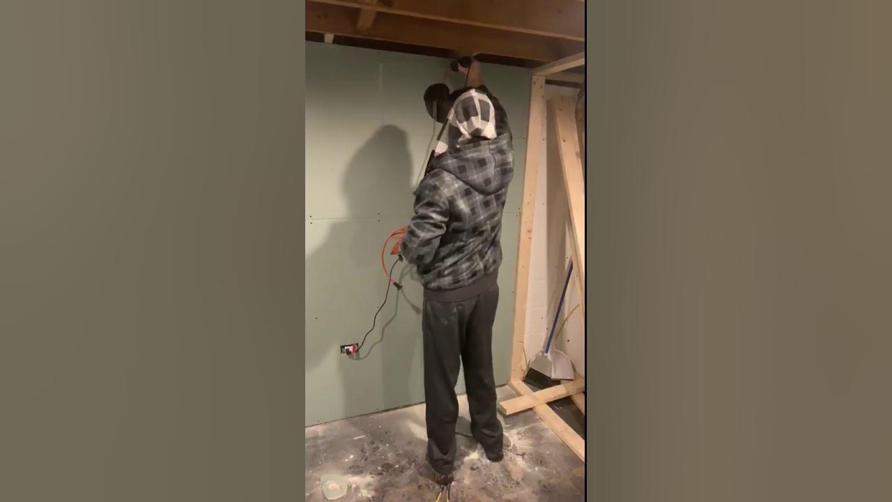 Using a dremel with a rotozip attachment to cut drywall window opening