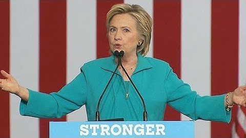 Clinton attacks Trump for promoting "racist lies"