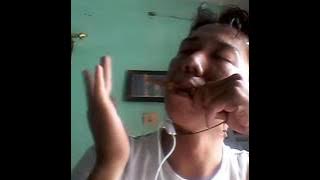 Playing Karinding ( Sundanese Bamboo Jews Harp )