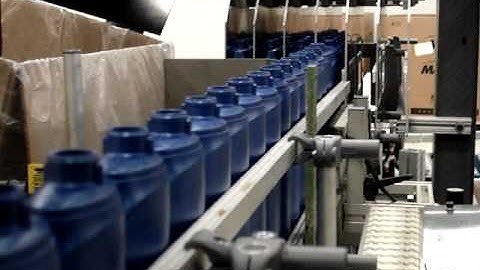 APT Manufacturing Solution Shampoo Bottle Case Load Close Up.MPG