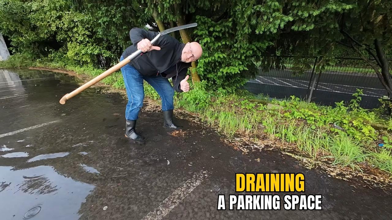 #070-2 Draining a storm drain on a parking lot after rain in Germany ...