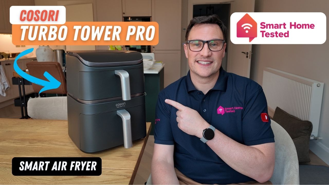Derek from Smart Home Tested in his kitchen with the Black and gold Cosori Turbo Tower Pro air fryer sitting on the table beside him