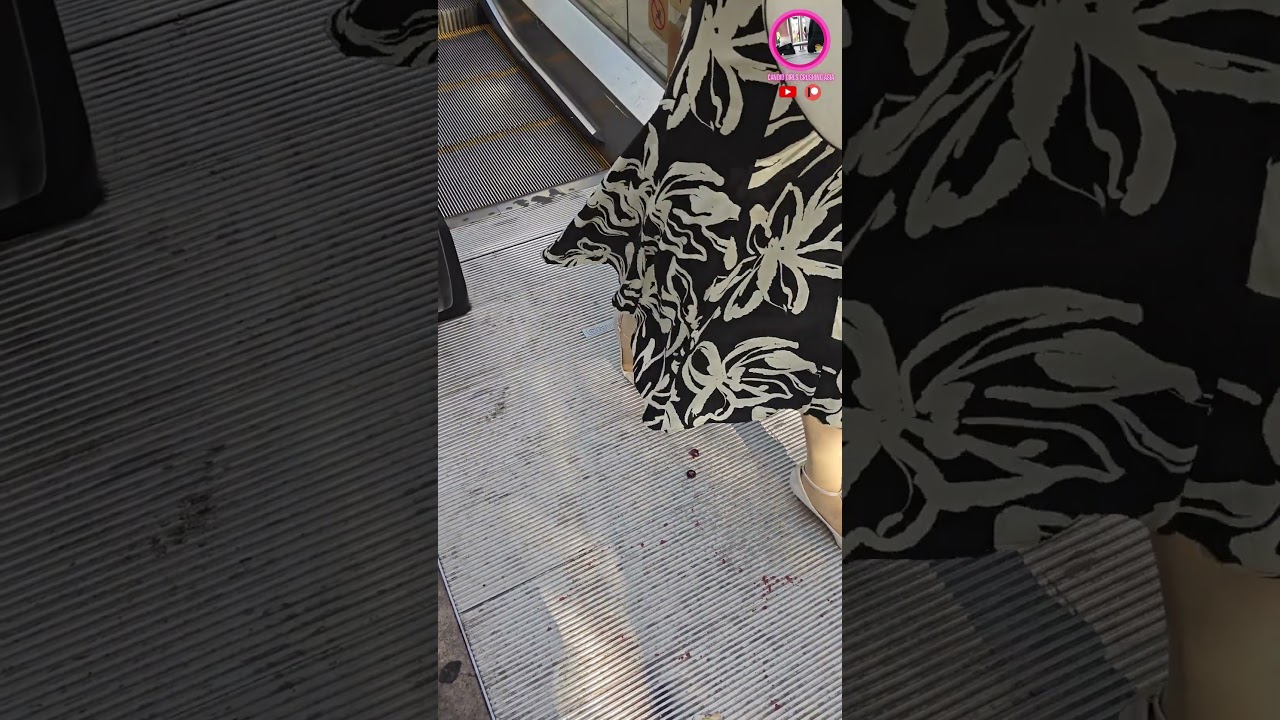 Candid fruit crush at escalator  