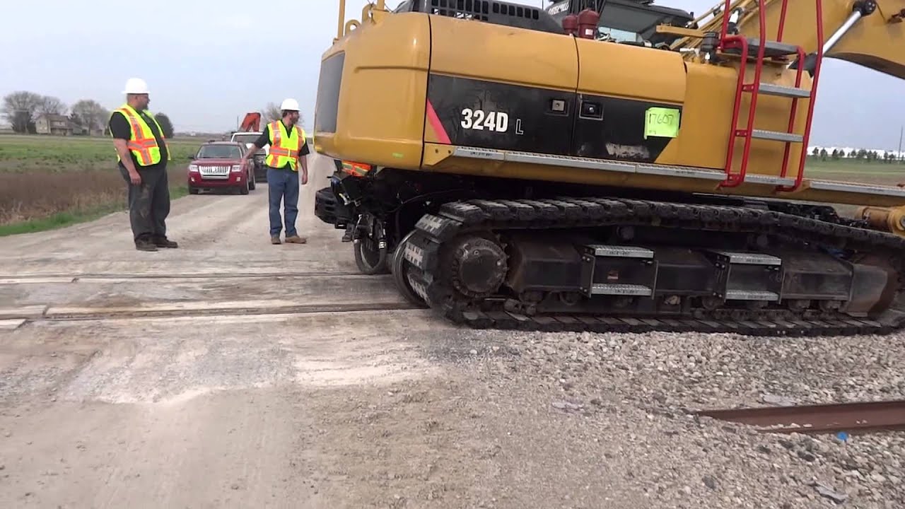 Cat 324HRE Low Auto Guide with Rubber Track Pads Video | Mitchell Rail Gear