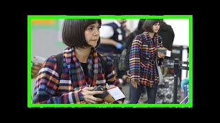 Breaking News | Nina dobrev rocks a plaid coat while boarding a flight back to la