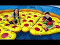 Kids play with large inflatable pizza in the pool, funny kid video