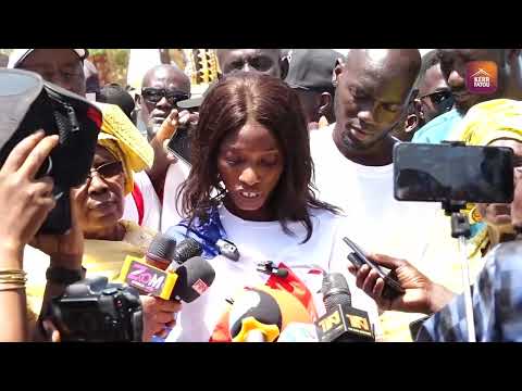 Binta Senghore reading the petition at the UDP Youth Wing's peaceful procession against corruption.