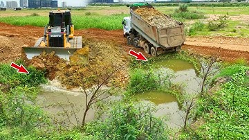 OH,Perfect Using a Shantui Dozer dropping soil delete small pond-clean weeds and dump trucks filling
