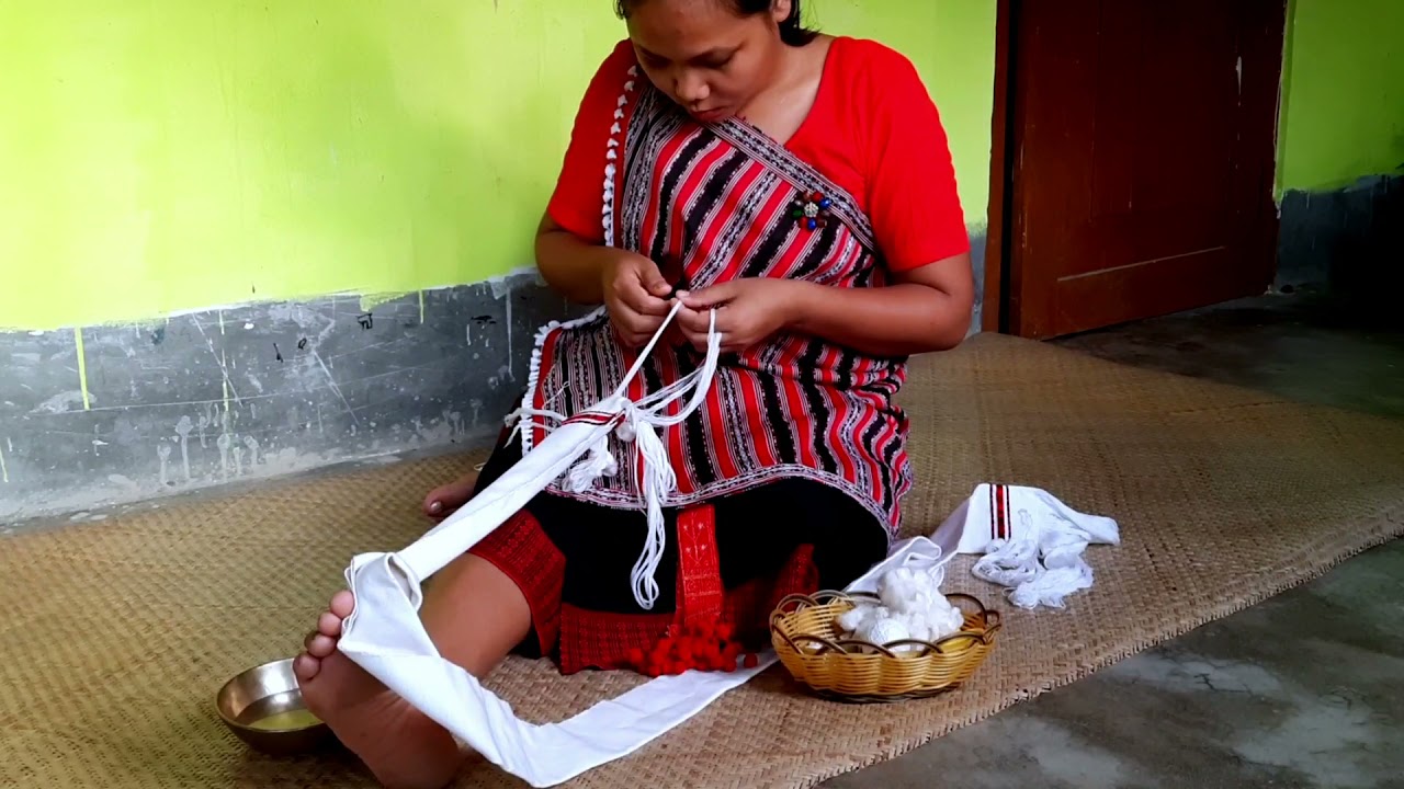 CHEPAN SOBAI KEHOM | | Decorating the fringes of Chepan with Cowrie-shells | | PHIRTHAK