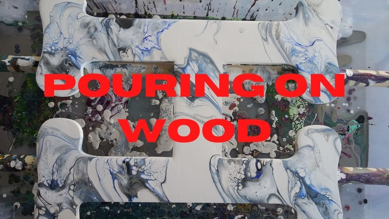 31. Marblized Acrylic Pour on an untreated wood letter H