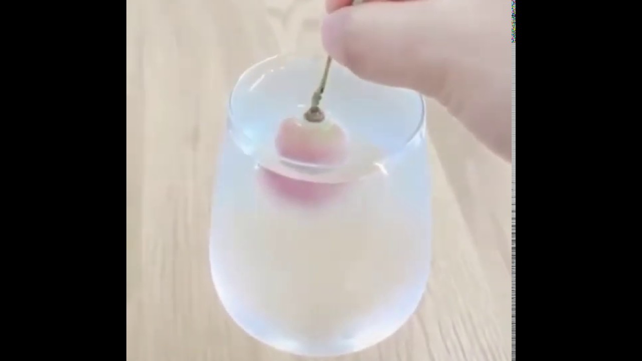 The fascinating result of a frozen grape dipped in chilled water.