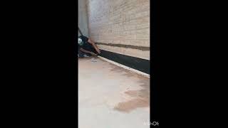 colocación de ruberoid como barrera de humedad