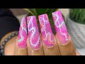 Long pink Abstract Gel-X Nails