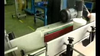 Wrap Around Up Labeling System for Conical Products