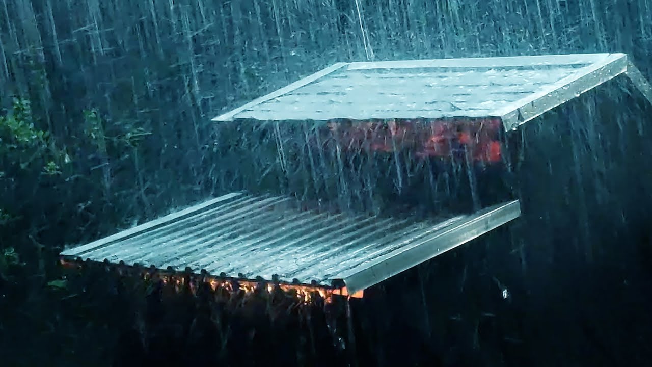 The stormy night poured down on the roof. The sound of rain has a ...