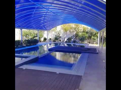 فيديو: مظلة حمام السباحة المصنوعة من البولي كربونات بيديك