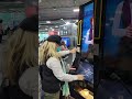 Cecilia the AI bartender is making a drink at CES 2022 expo in Las Vegas, NV