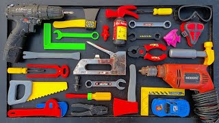 Collection of Repair Tools, Electric Drill, Electric Saw, Hammer With Wriench, Pliers, Hacksaw