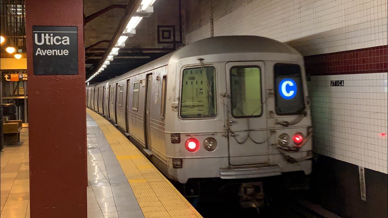 A uptown r46 a train and a queens bound r160 e train depart the 14th street...