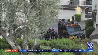 Robbery suspect arrested after 8-hour standoff