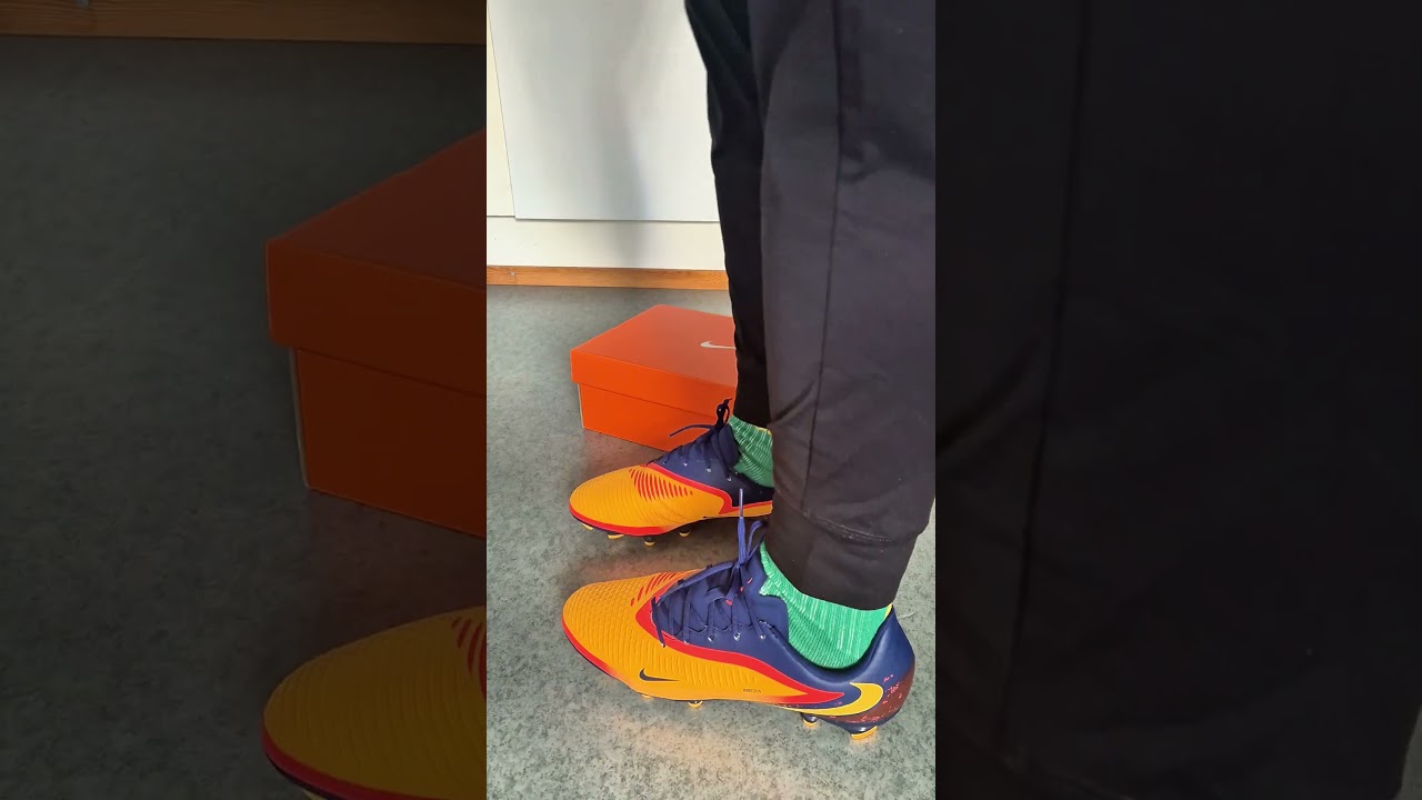 Lacing up Nike Phantom 6 Academy Low EH 