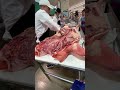 Butcher Cuts up a Pig at Newly Opened H Mart in Long Island City, New York