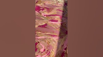 Artist is chopping and combining different colors of polymer clay to make earrings!