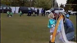 Young girl knocked over backwards into soccer goal