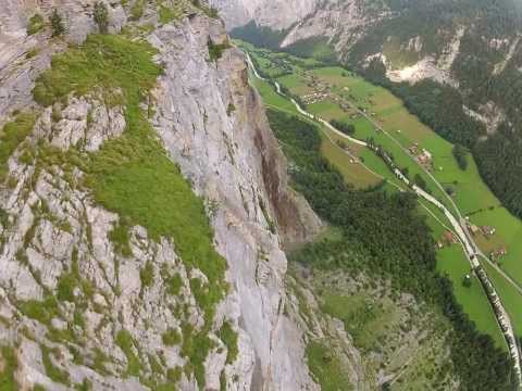 Wingsuit through waterfall in Lauterbrunnen