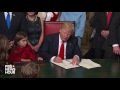 Trump signs first official documents as U.S. president