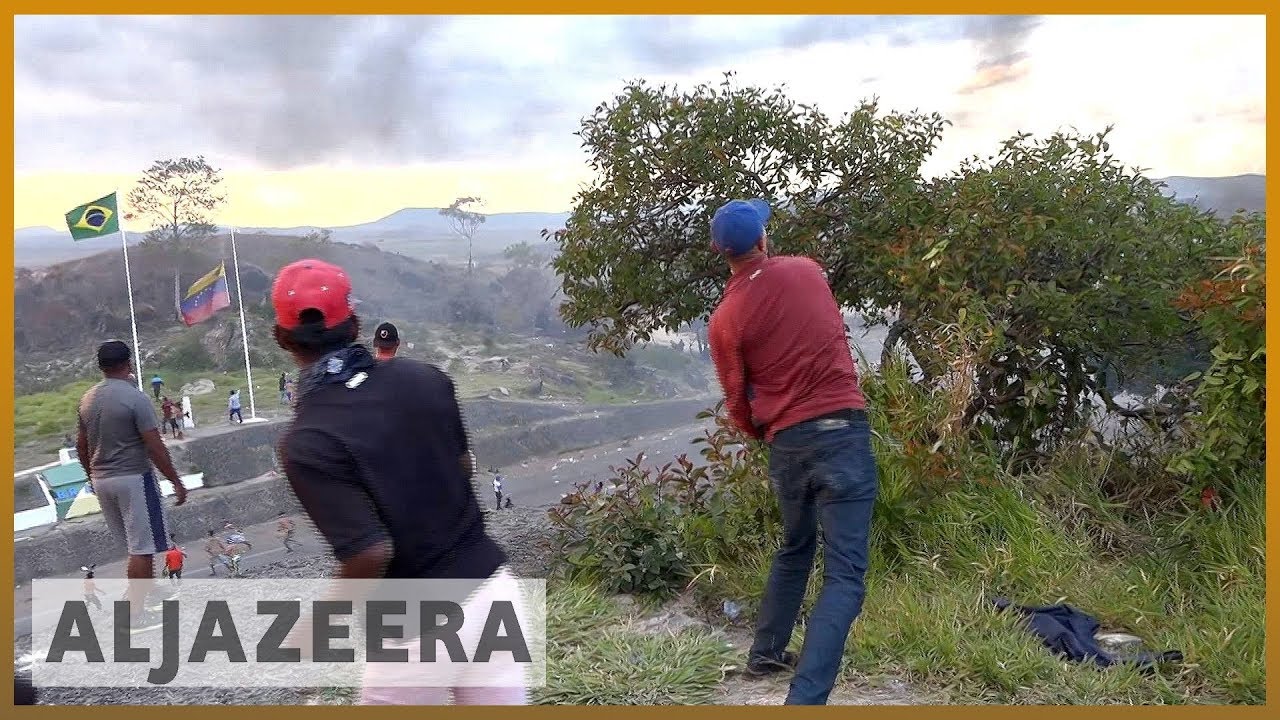 🇻🇪 🇧🇷 اشتباكات عنيفة بين مهاجرين فنزويليين وقوات فنزويلية | الجزيرة الإنجليزية