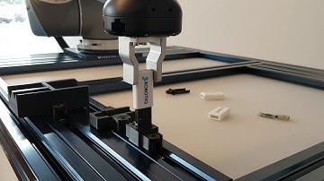 Universal Robot Using Robotiq Gripper for USB Assembly